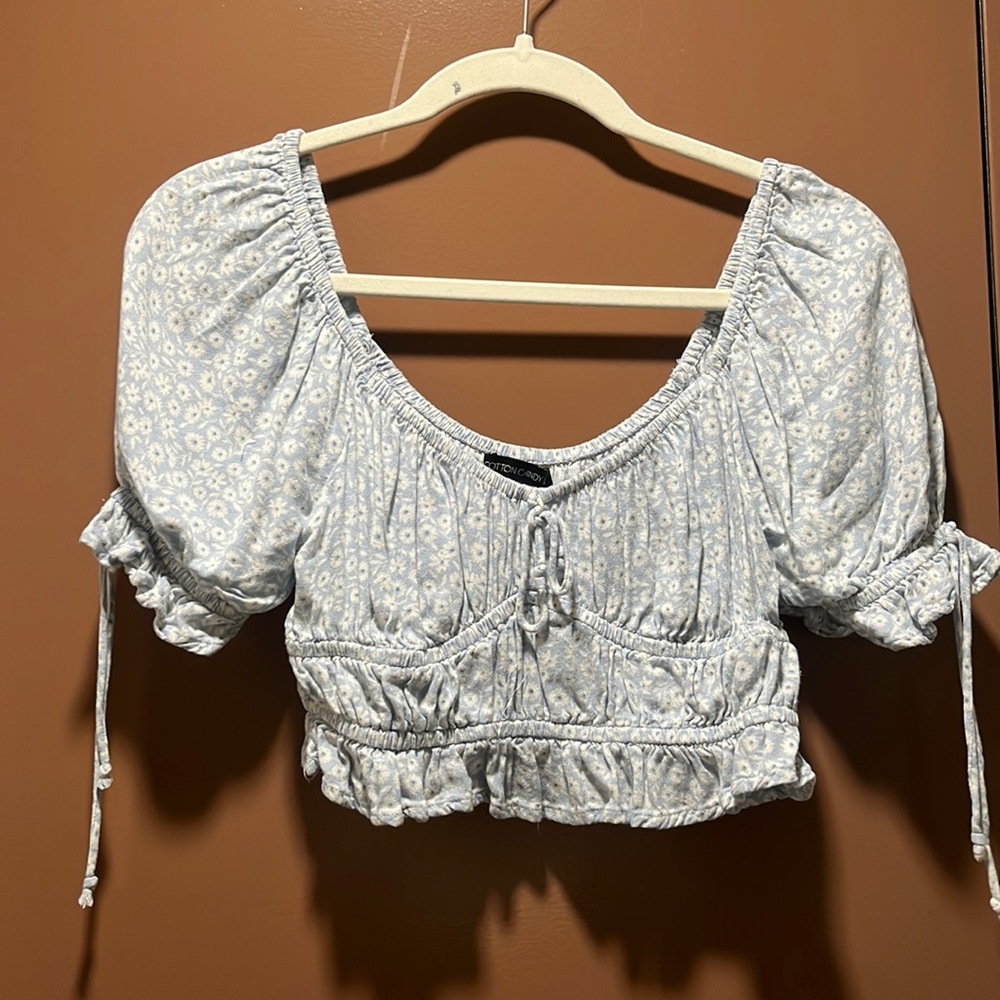 Cotton Candy LA blouse/crop top. Light blue with white flowers.